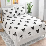 white bedsheet with black bow