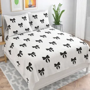 white bedsheet with black bow