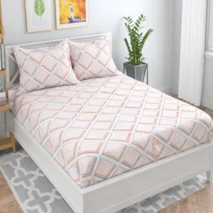 Peach and grey geometric patterned bedsheet with matching pillow covers on a neatly made bed